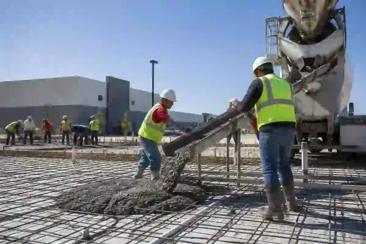 Concrete workers pouring a commercial foundation slab in Central Texas